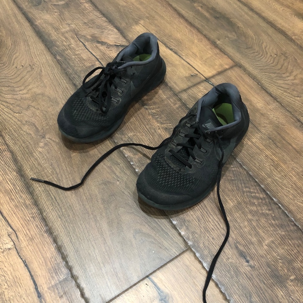Black on black Nike free running shoes